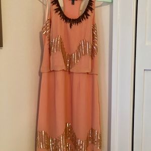 Stunning coral dress with intricate beading!